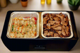 The Dubler HEAT is unique innovation as a flameless chafer and cooler combination that fits two 1/2 size food pans and up to 4” depth.  The premium insulation, along with the heat packs and placing hot food trays straight from oven, provide a slow drop in temperature over time.  Enjoy hot to eventually warm food for hours while the outside remains safe to touch for easy mobility.